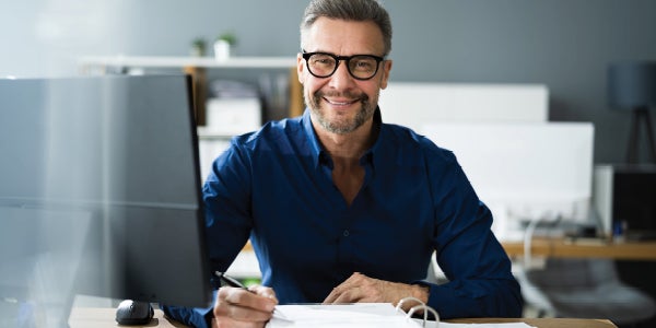 Man working from home using note pad