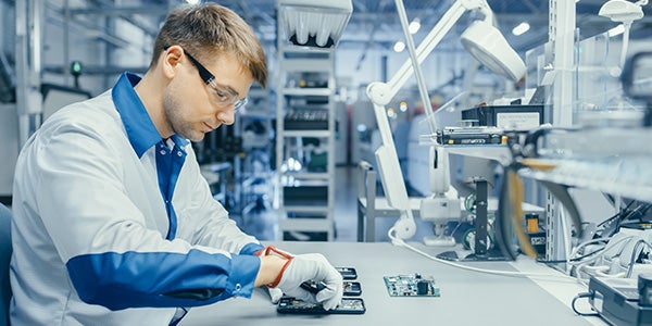 Man manufacturing cellphones